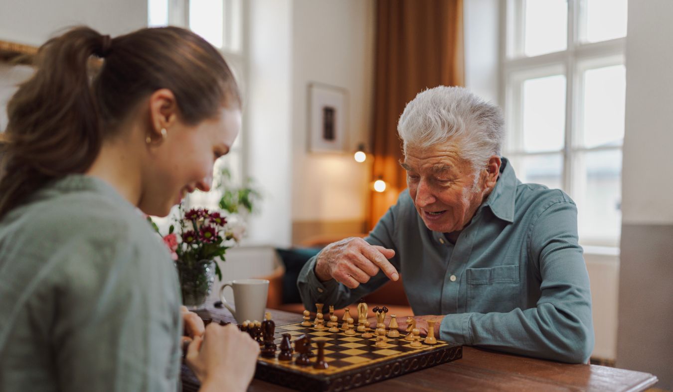 grandfather gandaughter playing chess
