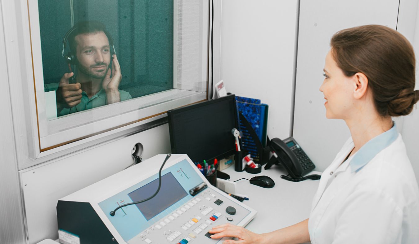 hearing test female provider young male patient