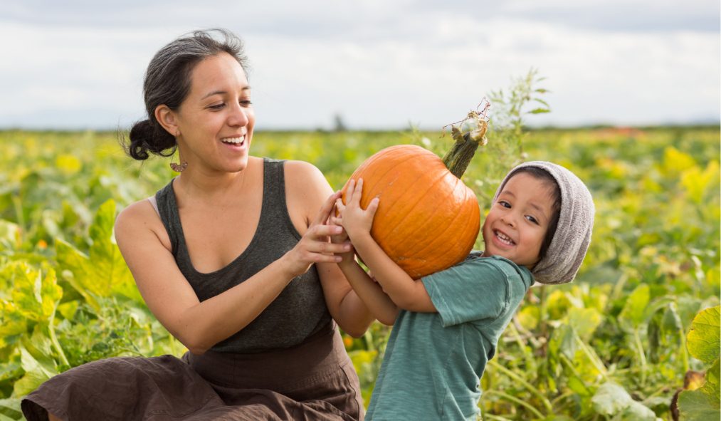 mother and child with pumpkin