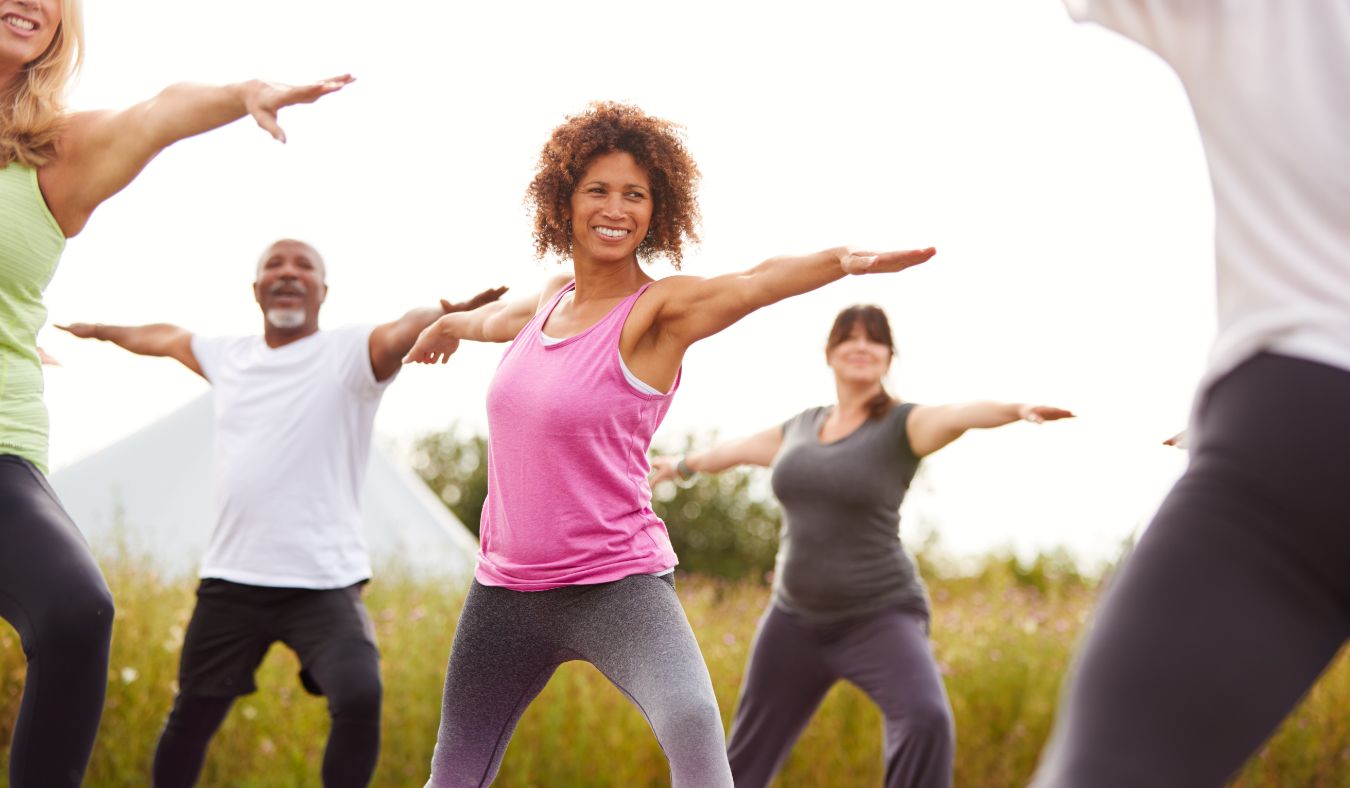 exercise mature woman stretching in group