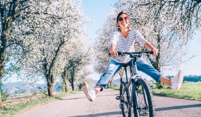 event image spring bicyclist cherry blossoms