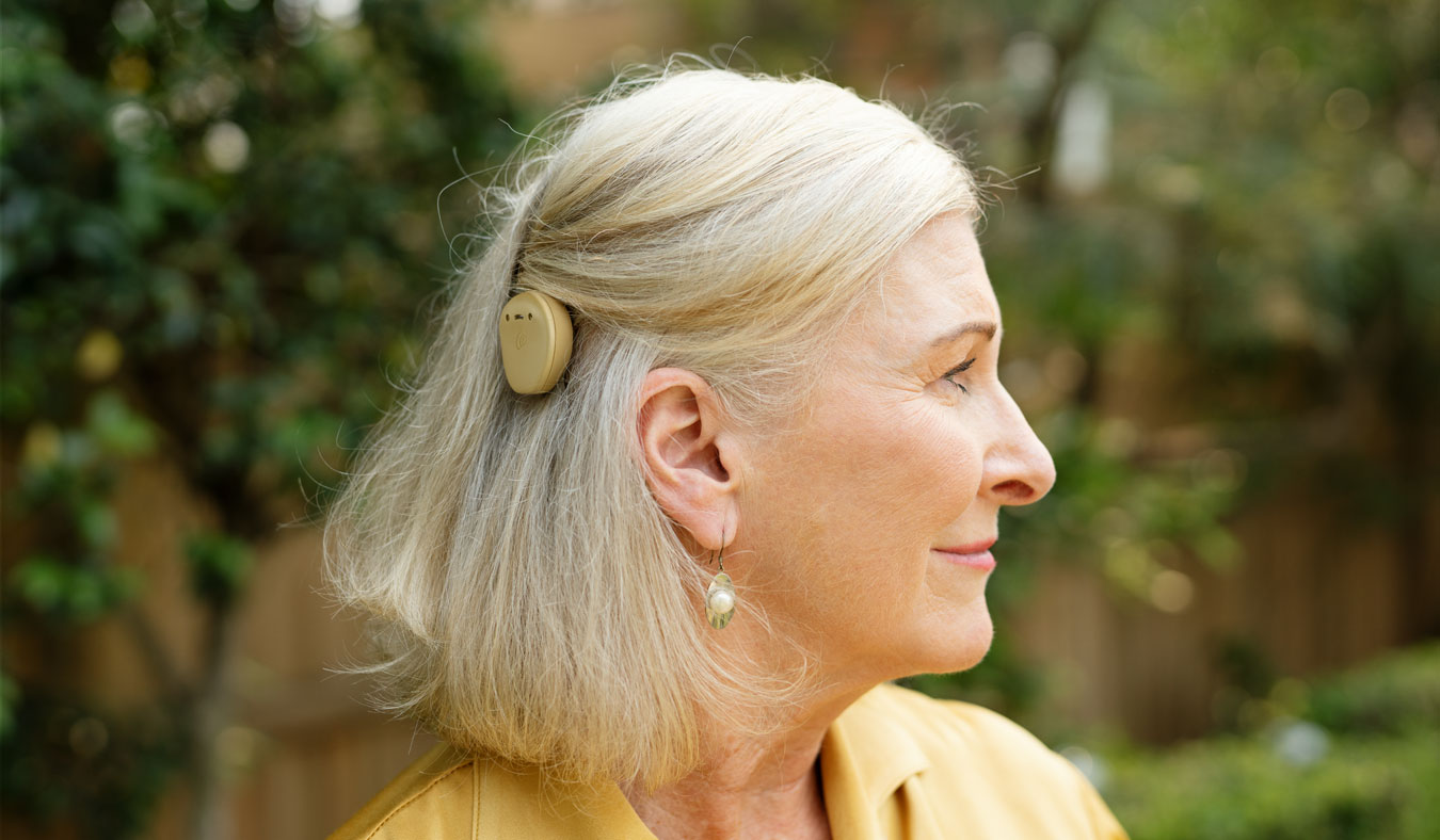 cochlear implant on mature woman from side