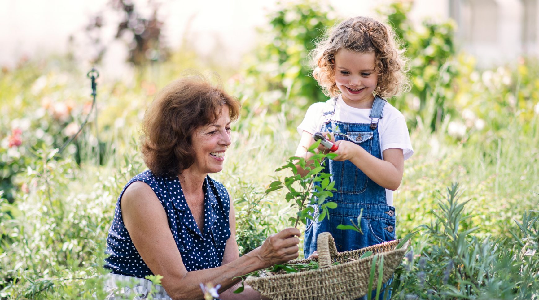 banner image mature woman granddaughter in garden@2x