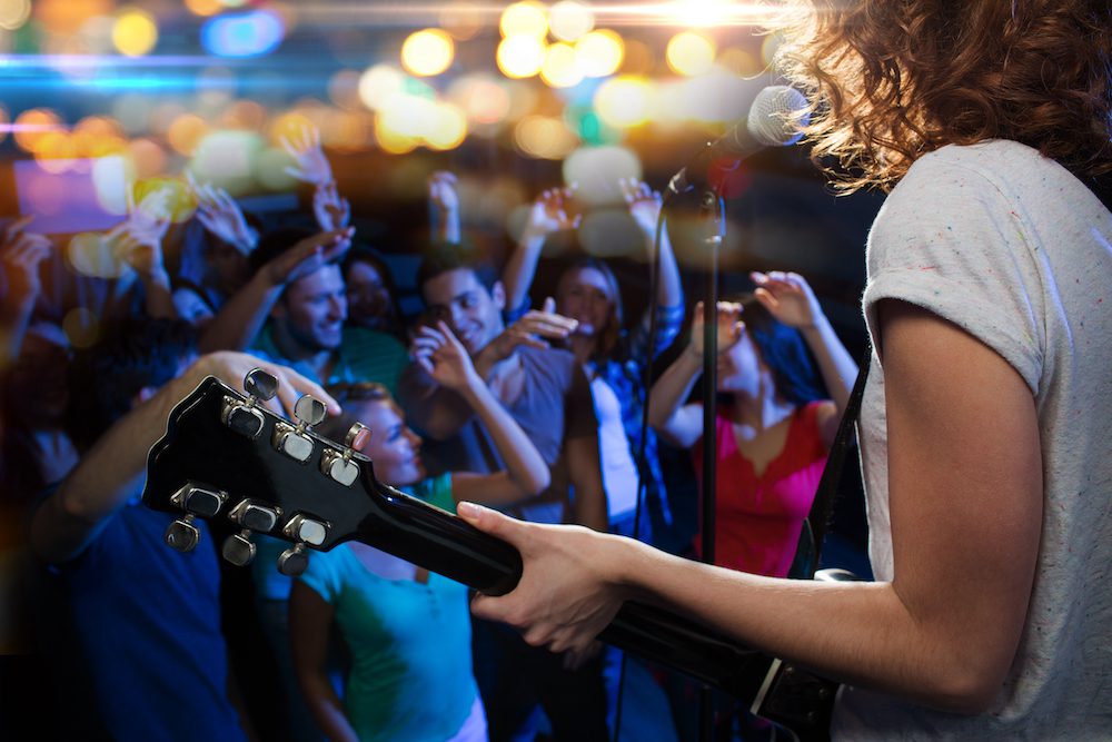 musicians playing at a rock concert