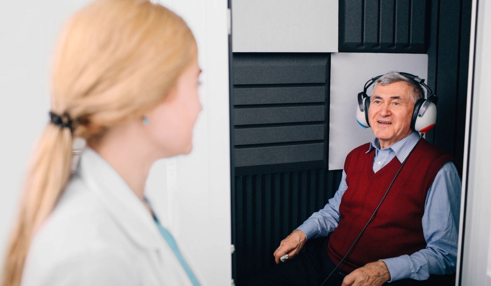 hearing test mature man in booth