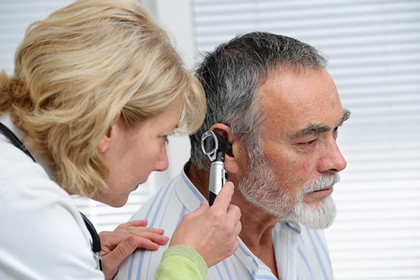 a man with hearing loss in an ear exam