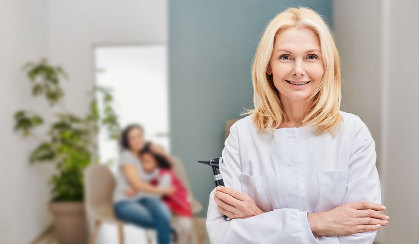 audiologist with otoscope
