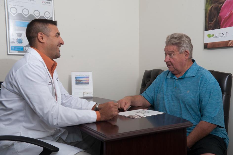 patient receiving hearing test from slent hearing
