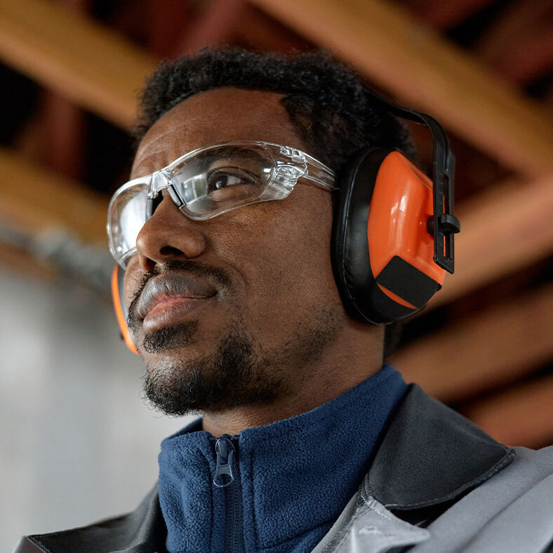hearing protection with people man wearing hearing protection during work