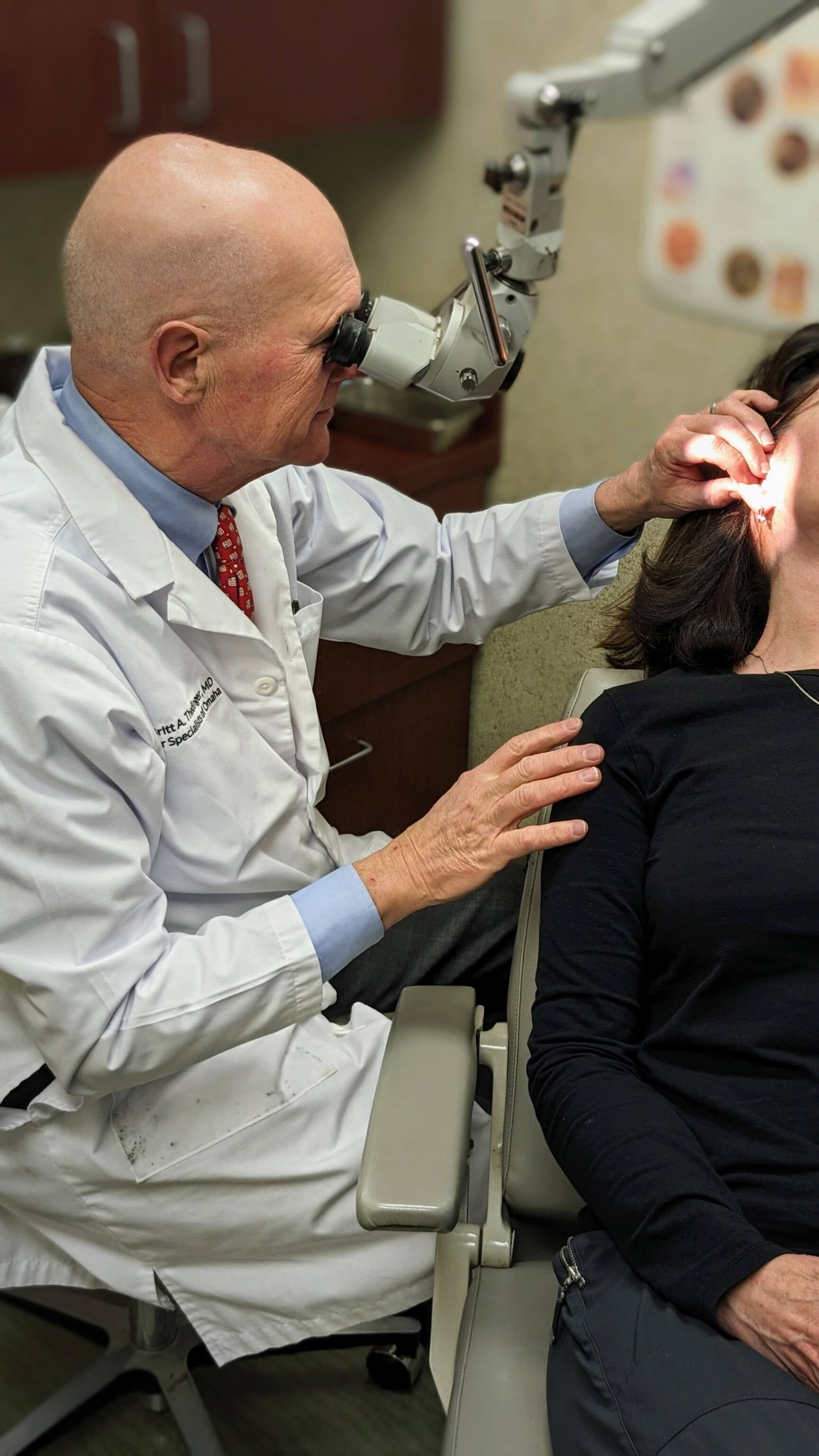 doctor checking ears