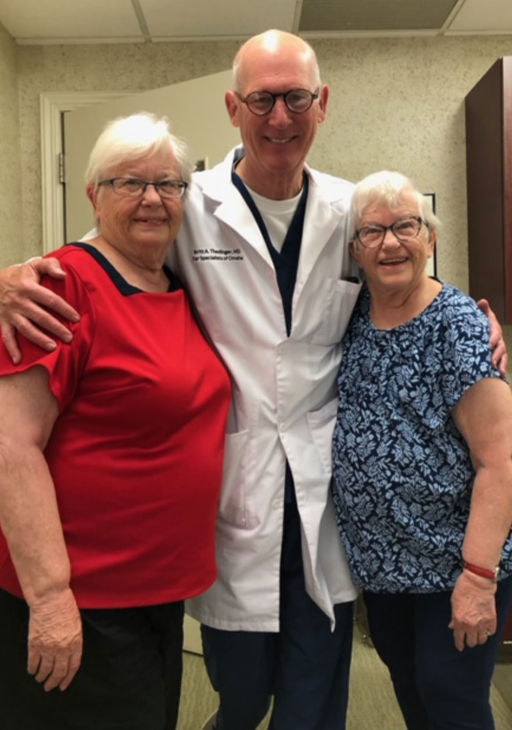 Dr Thedinger with twin sisters patient