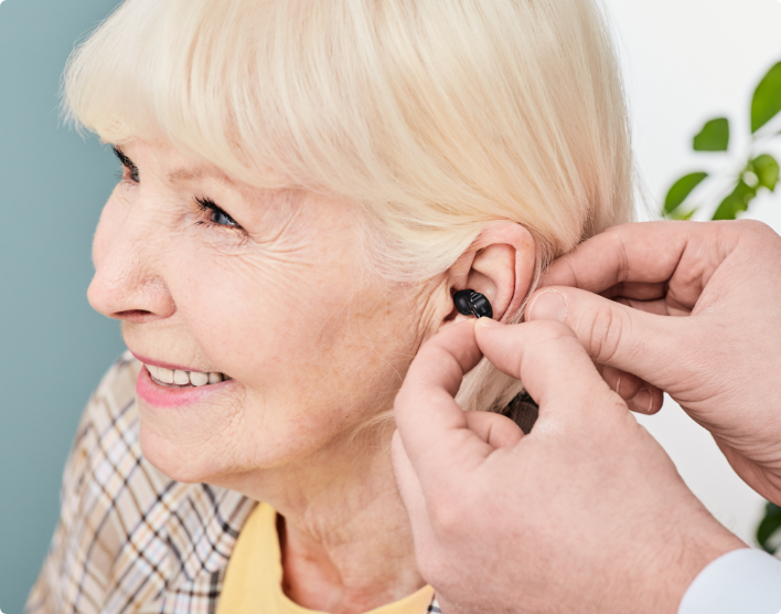 women trying hearing aid