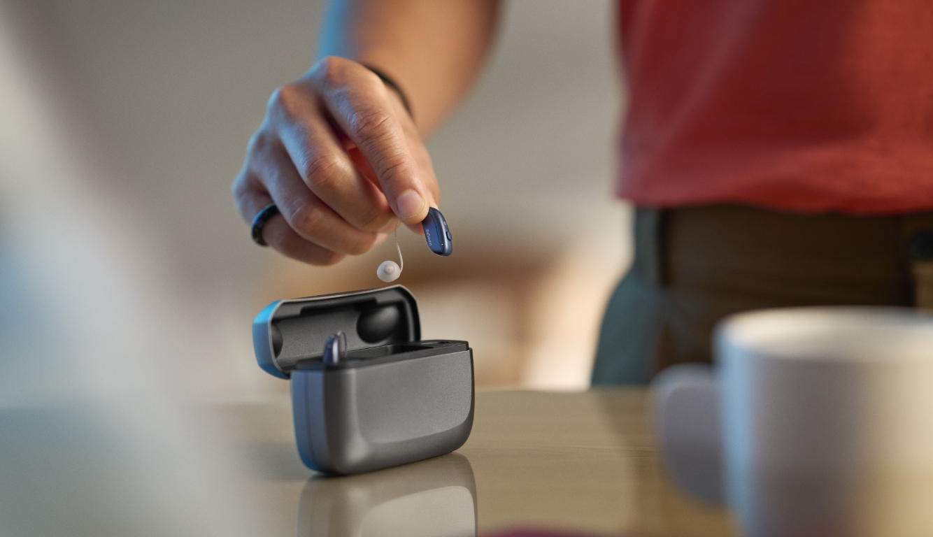 resound vivia hearing aid in hand