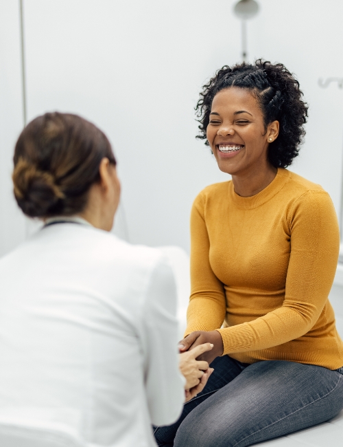 Young woman during a consultation with a hearing care provider.