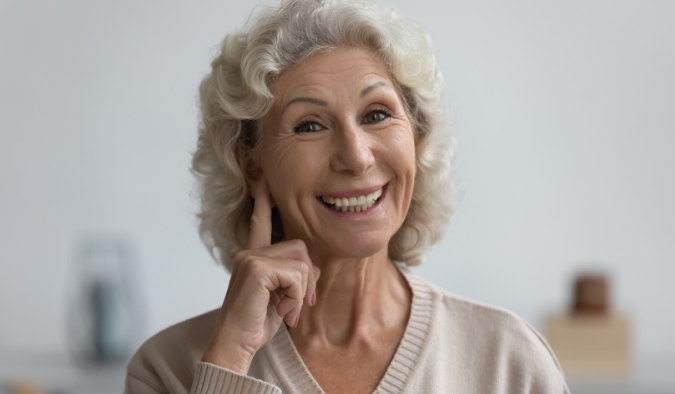 event image finger to ear mature woman