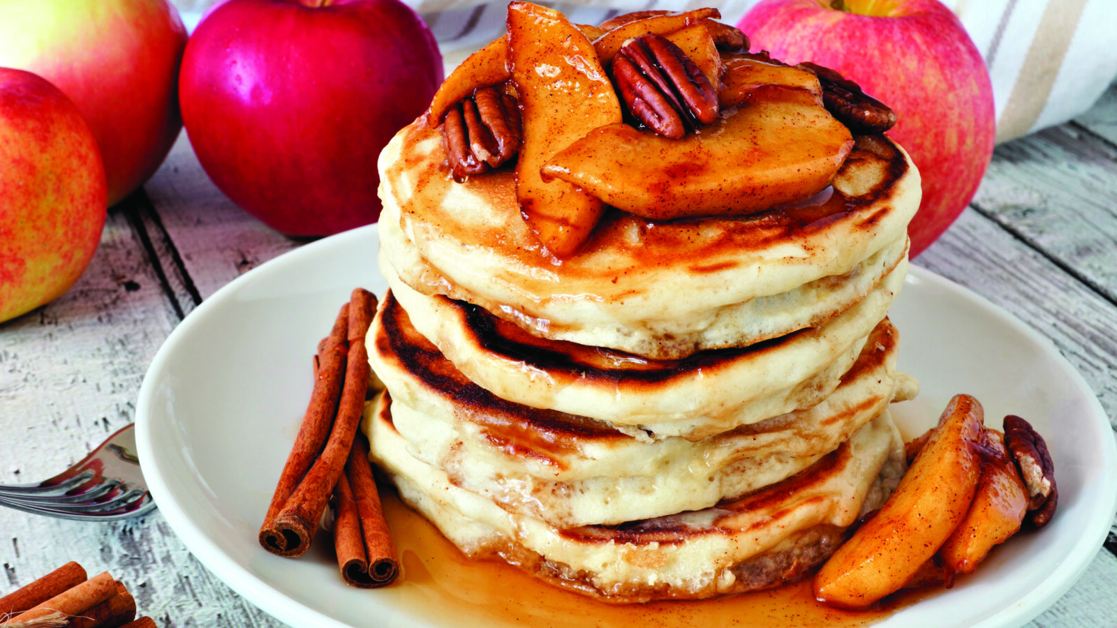 Autumn,Pancake,Stack,With,Baked,Apples,,Pecans,And,Cinnamon,Topped