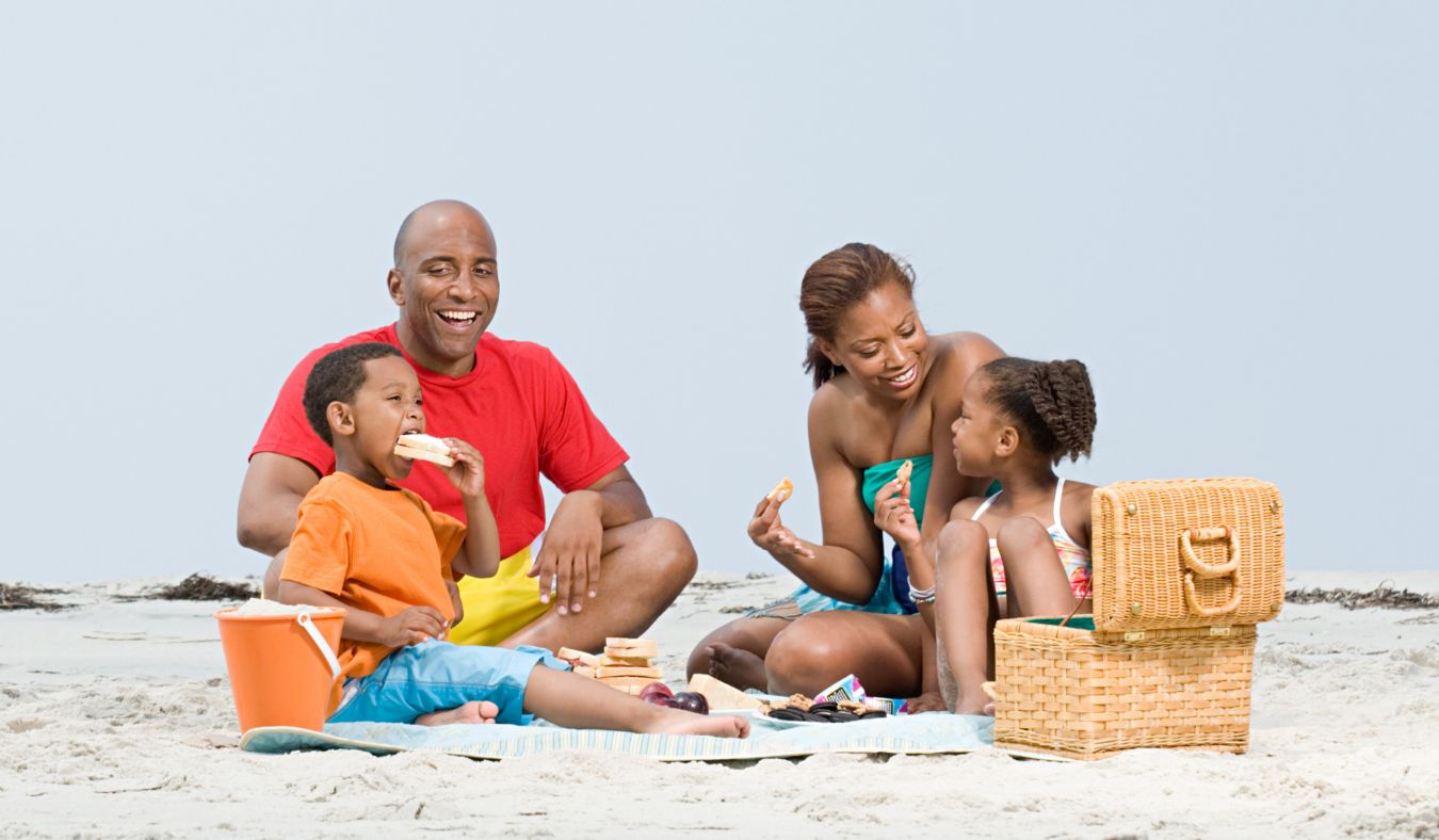 beach black familly having beach picnic