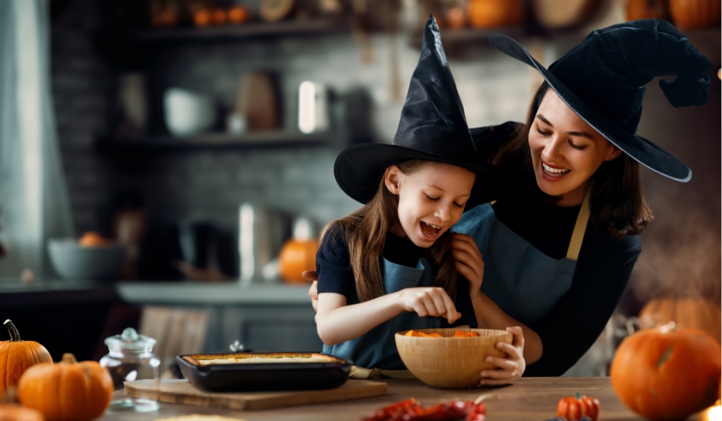 events halloween daughter mother dressed as witches baking
