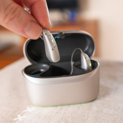 microsite product brands closeup hearing aids in charger