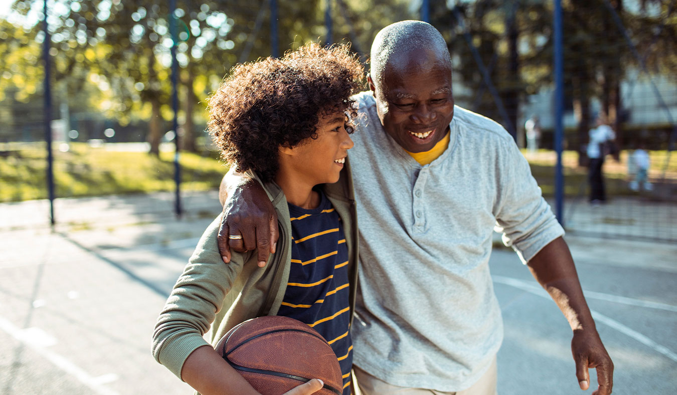events grandfather playing basketball with grandson