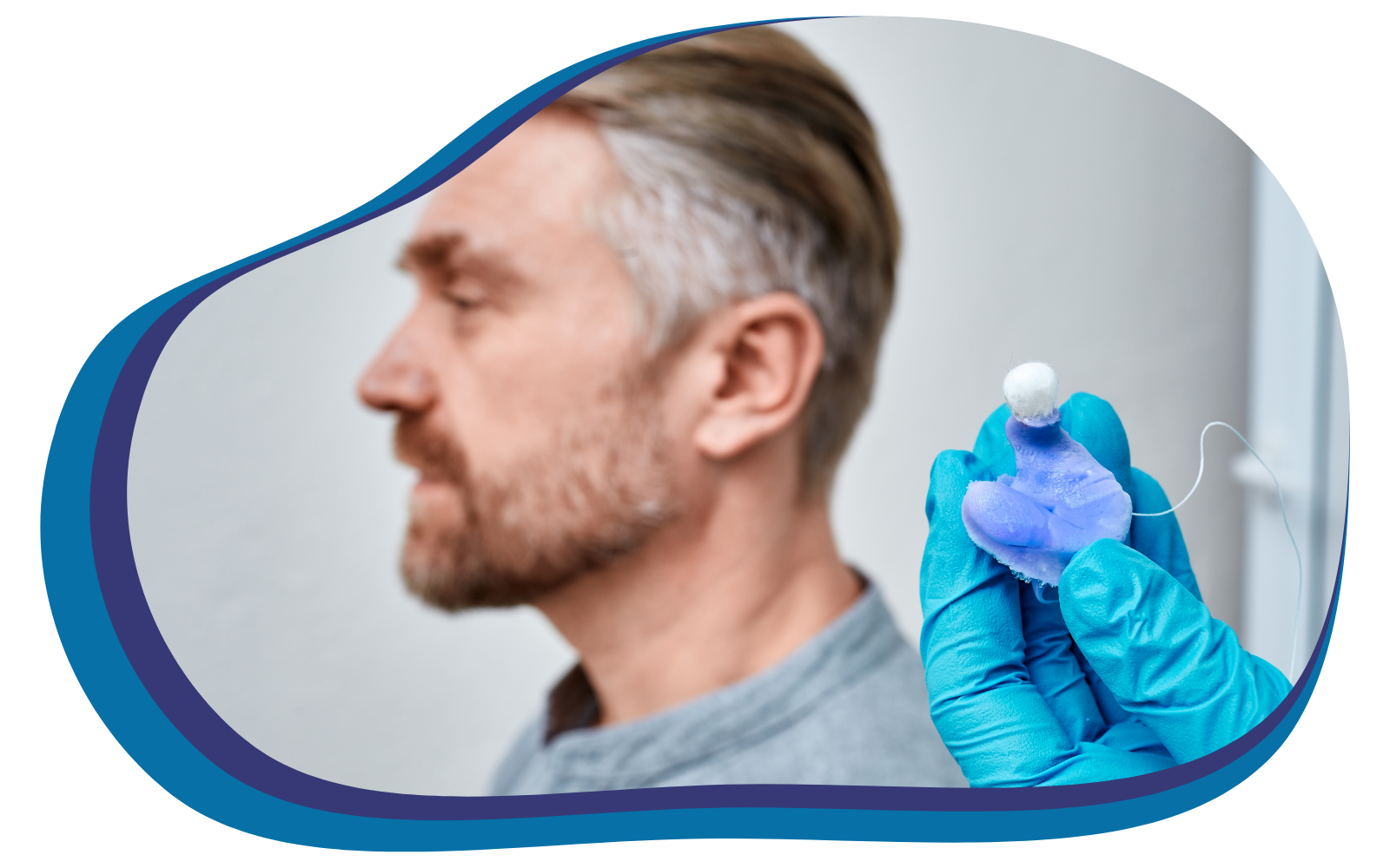 custom ear mold taken from mans ear