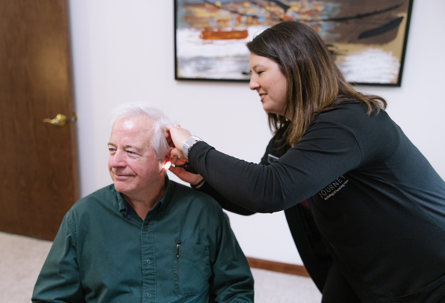 dr rachel looking in patients ear