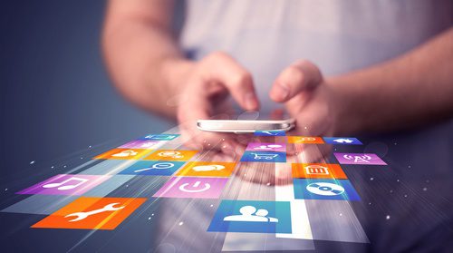 image of man holding iphone