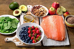 feast prepared on cutting boards apples blueberries and more