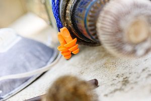 orange ear plugs on table