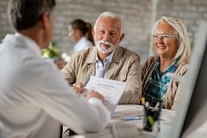 senior couple discussing health insurance
