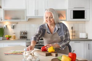woman cooking in her home kitchen