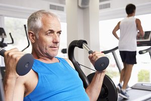 man working out in commercial gym