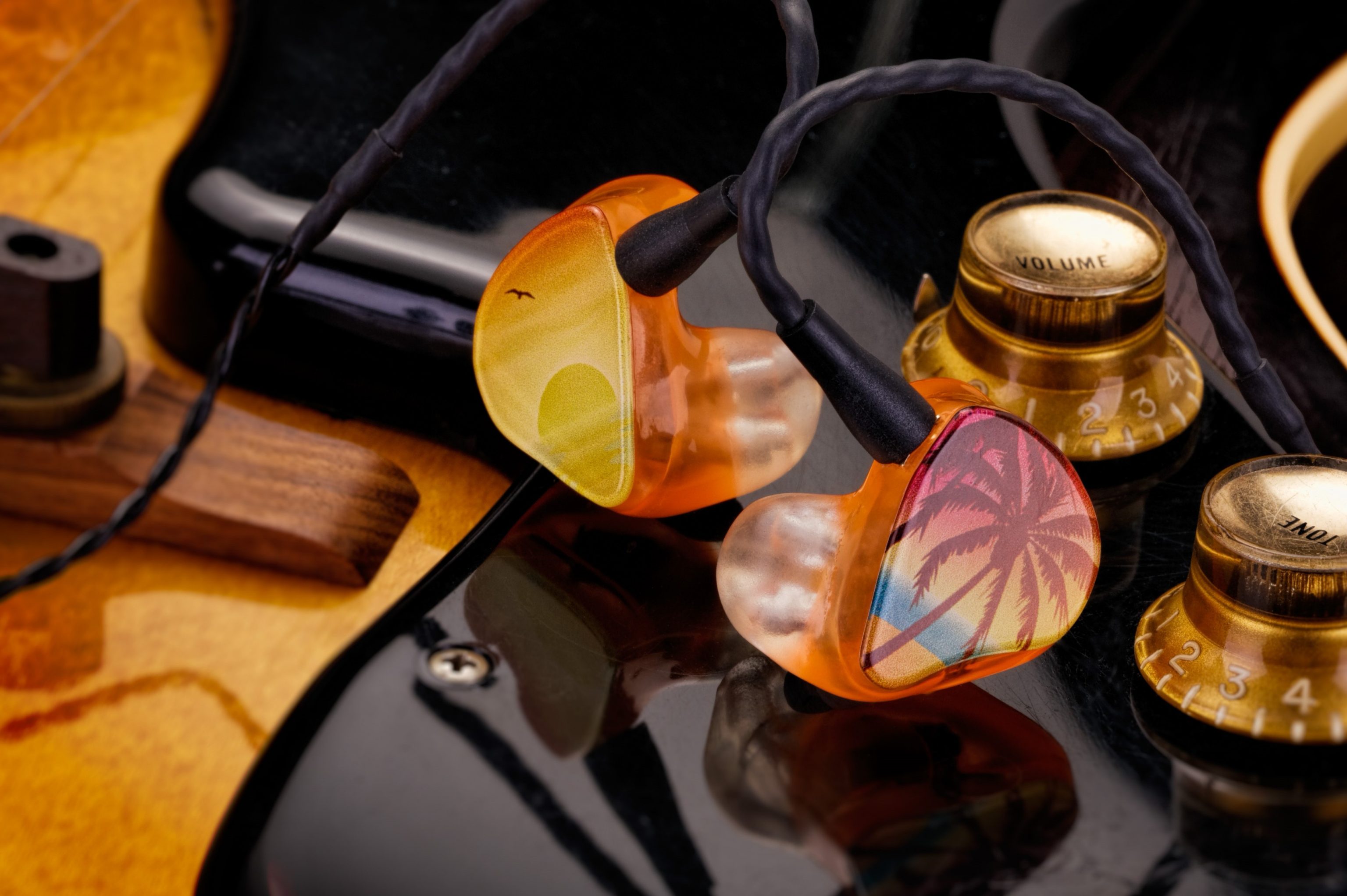 custom westone earbuds in black yellow and orange