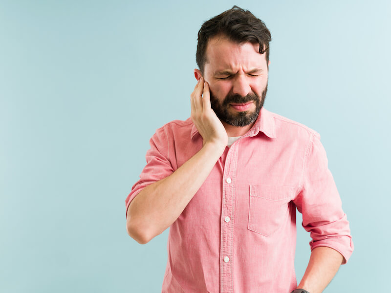 man with bad ringing in his ear