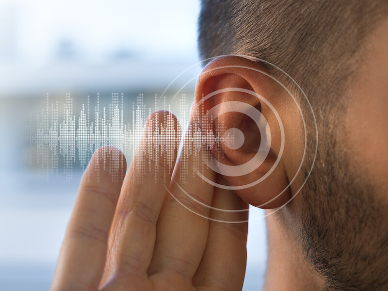 man with hand to ear and graphic