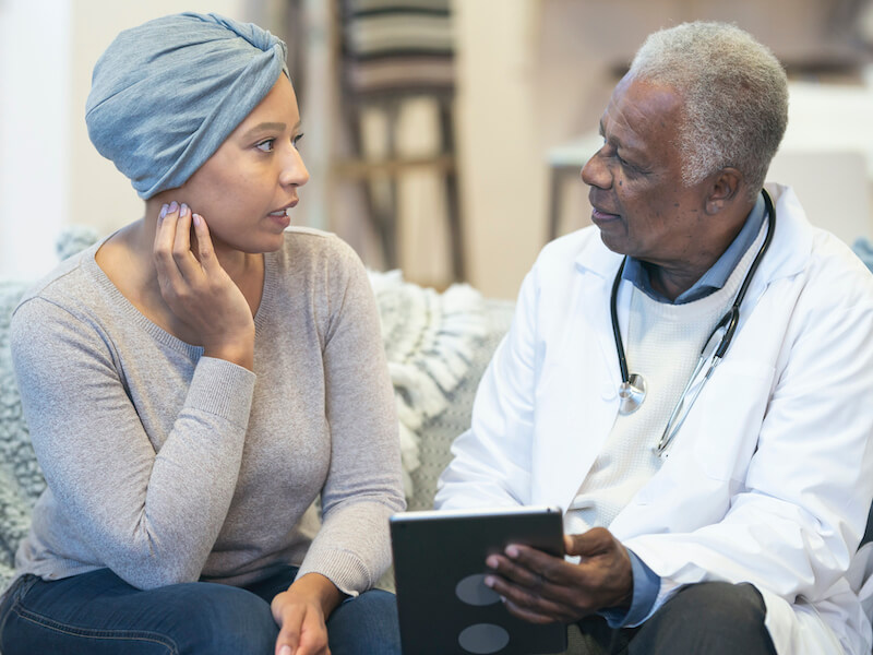 doctor talking to his cancer patient