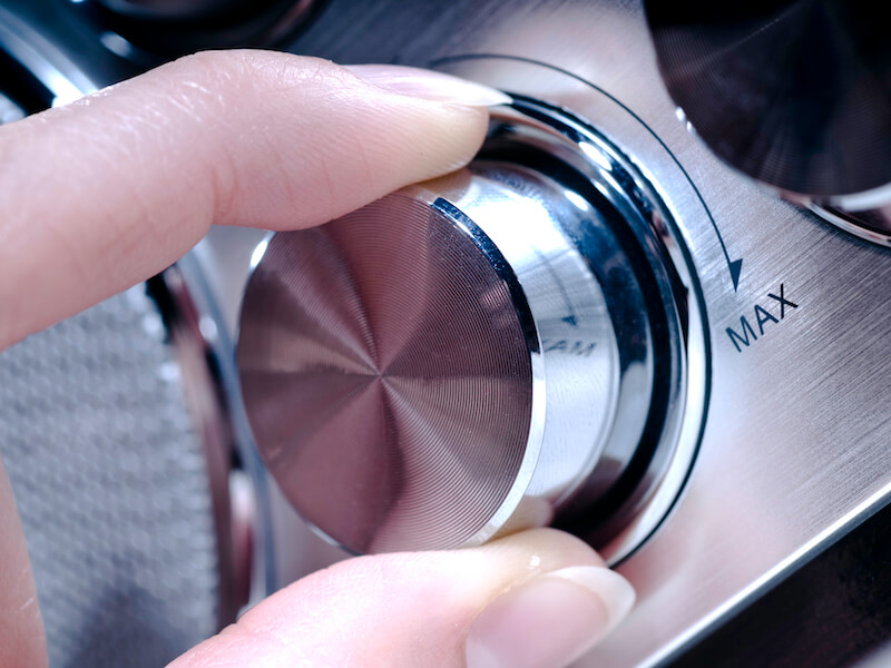 hand adjusting volume dial