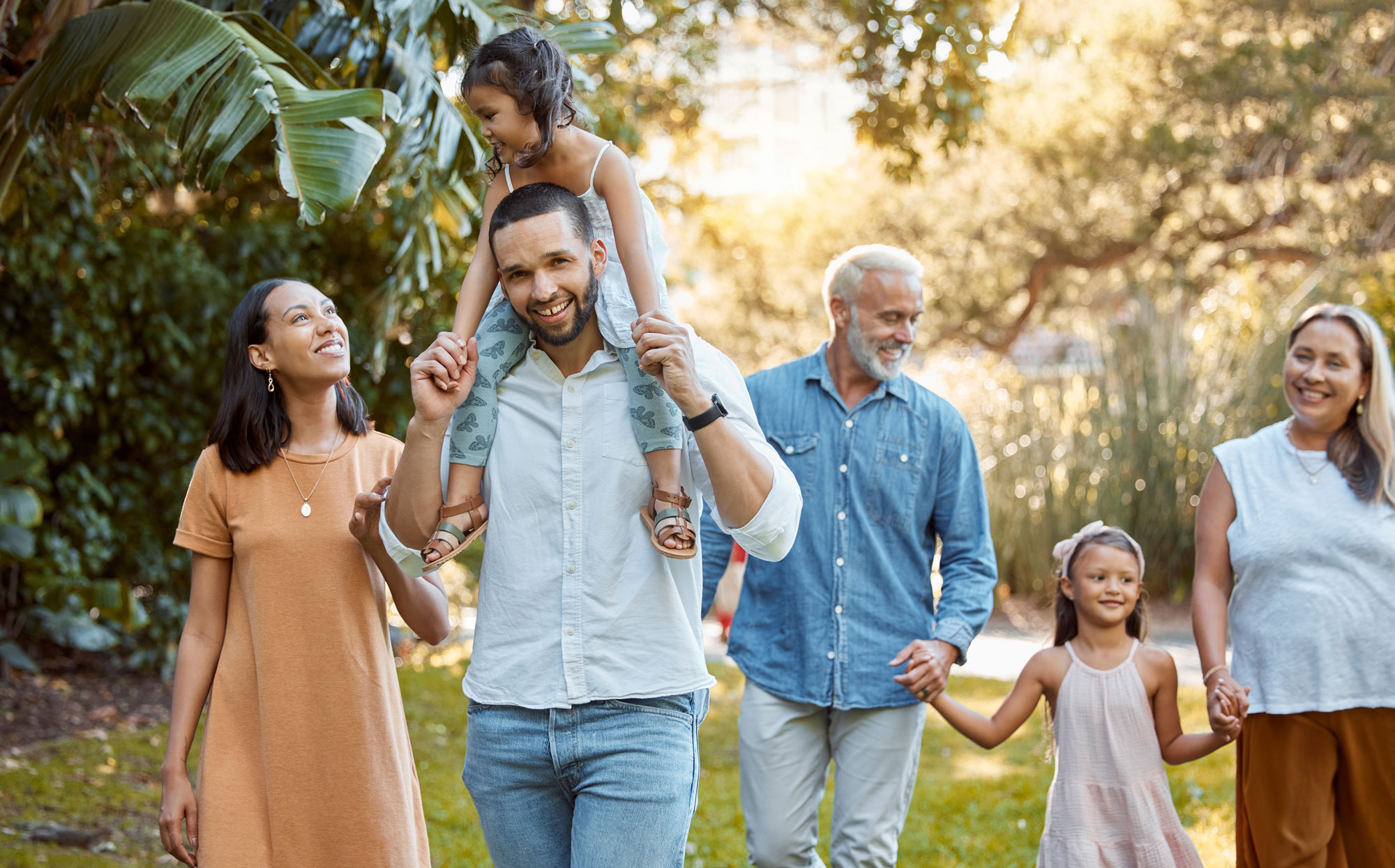 three generation family walking tropic climate
