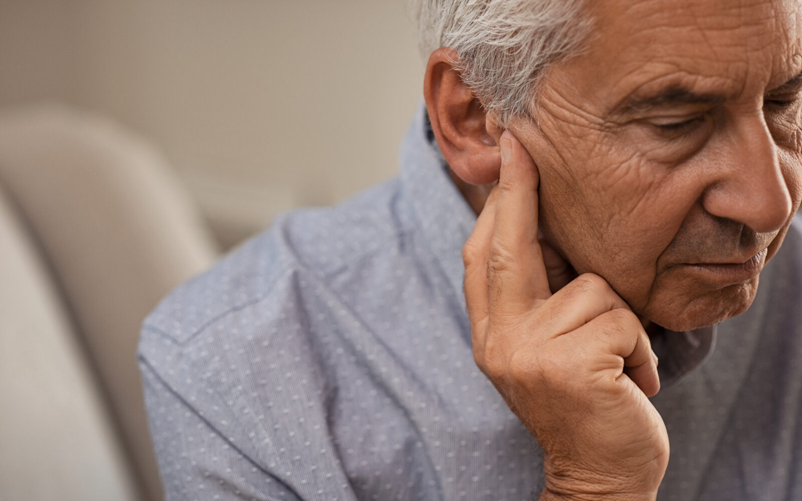 Side,View,Of,Senior,Man,With,Symptom,Of,Hearing,Loss