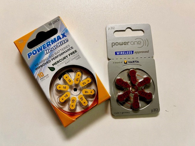 two hearing aid batteries in packaging