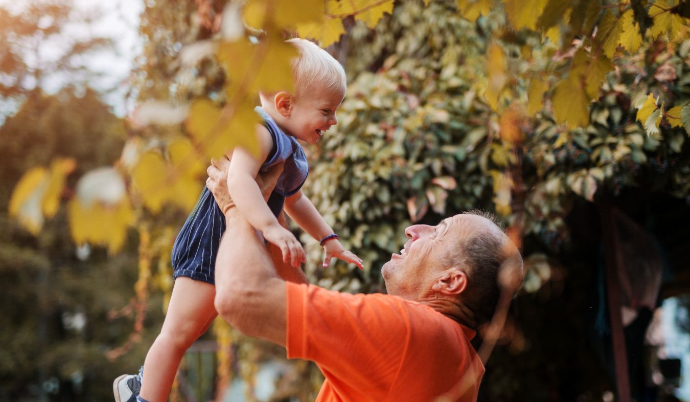 grandfather holding grandbaby