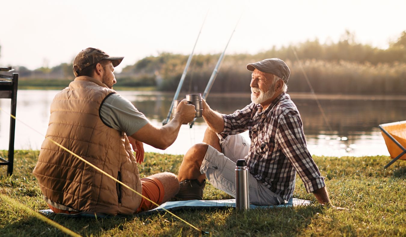 adult son and father fishing