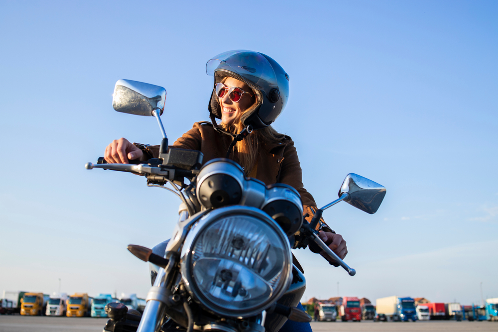 Female,Motorbike,Rider,Wearing,Helmet,And,Riding,Retro,Style,Motorcycle