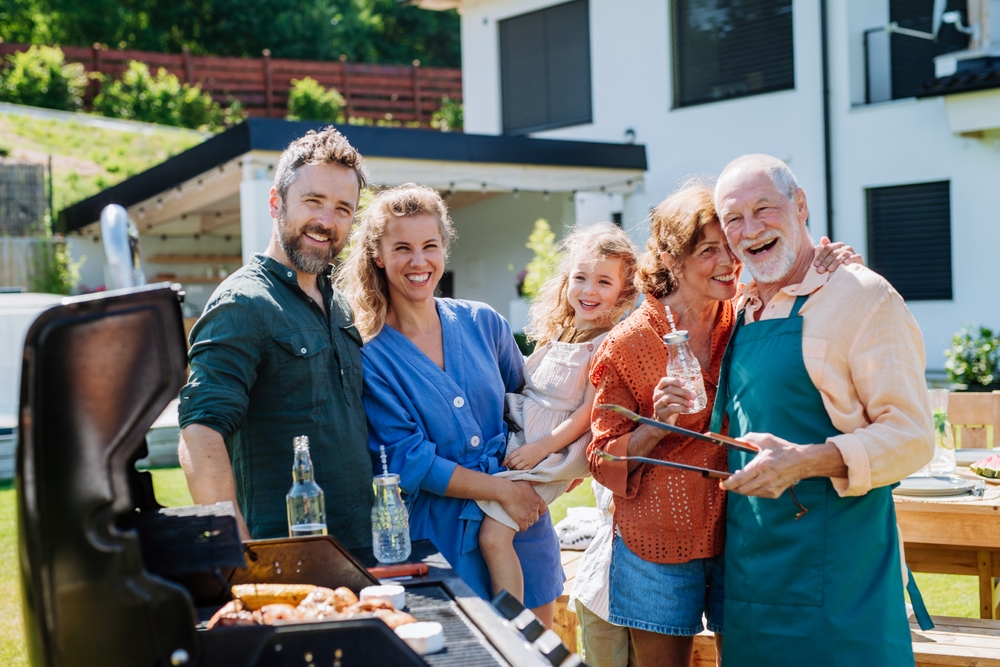Multi,Generation,Family,Grilling,Outside,On,Backyard,In,Summer,During