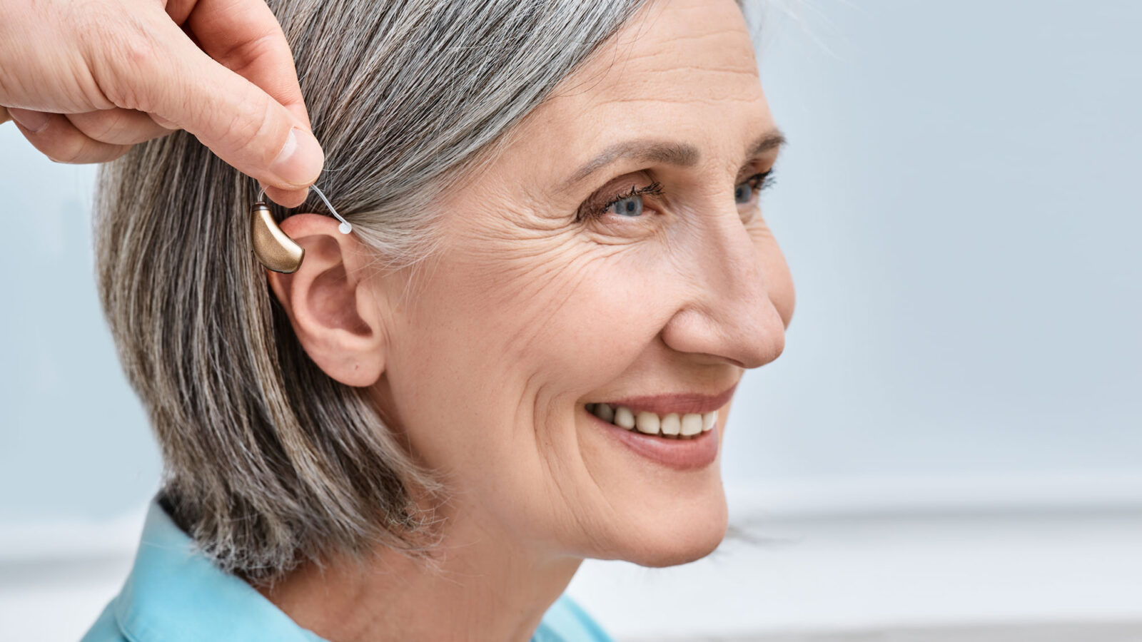 white woman hearing aid try on