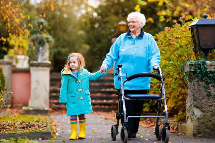 banner in column autumn grandmother holding granddaughter hand walking