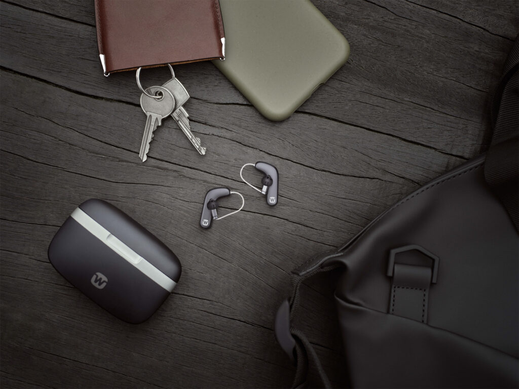 widex smart ric lifestyle flatlay aids with charger