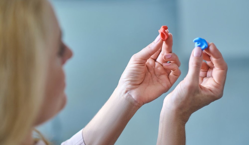 hearing protection ear molds in hand