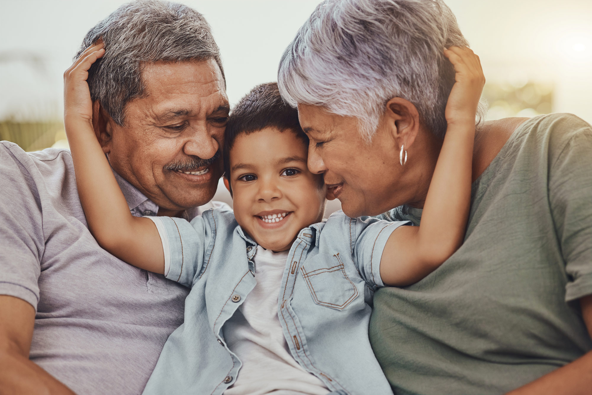 grandson hugging grandparents