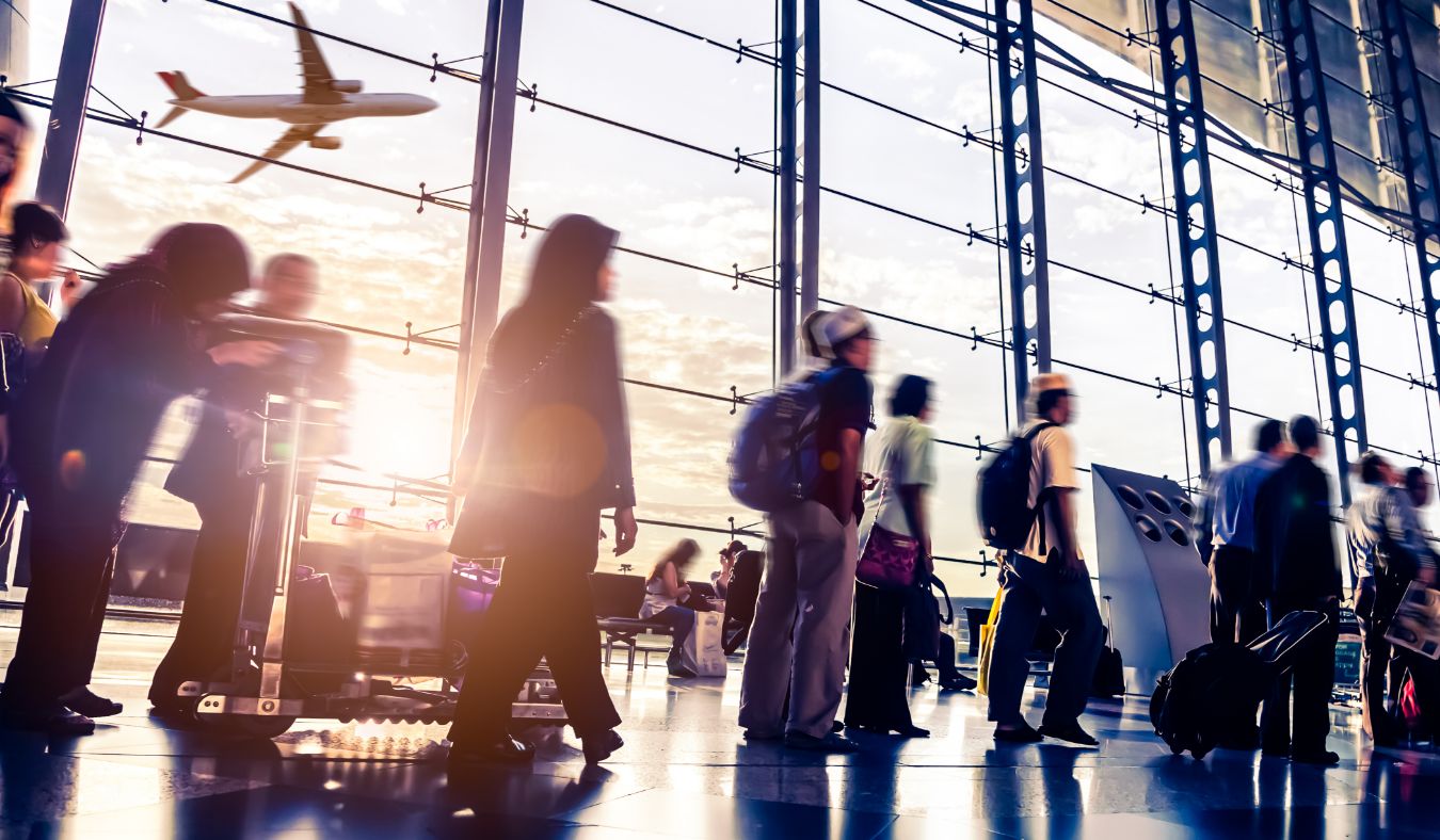 group walking towards gate airport